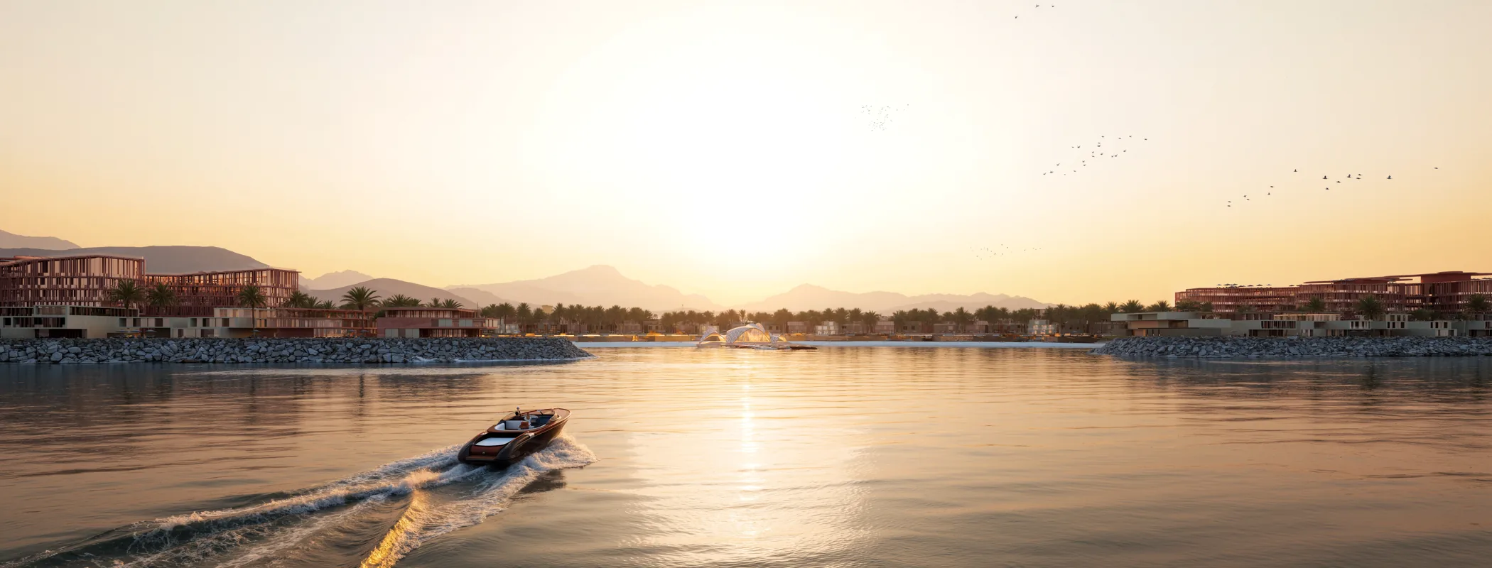 The Al Mairid coastline at sunrise with the Hajar mountains behind it